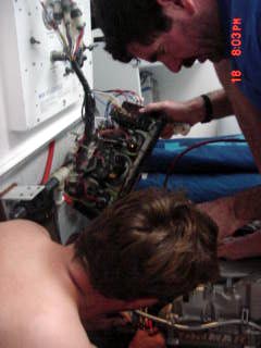 Mark and Nic working on the engine