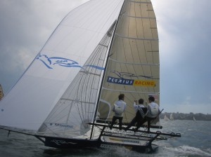 Pegasus Racing, Shark Kahn, Cameron MacDonald, and Geoff Moore sailing an 18 Foot Skiff during the World Championships in Sydney Australia 2005.