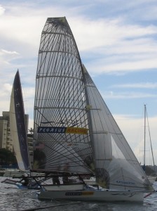 Pegasus Racing, Shark Kahn, Cameron MacDonald, and Geoff Moore sailing an 18 Foot Skiff during the World Championships in Sydney Australia 2005.