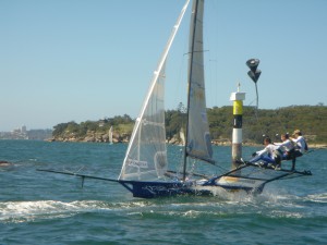 Pegasus Racing, Shark Kahn, Cameron MacDonald, and Geoff Moore sailing an 18 Foot Skiff during the World Championships in Sydney Australia 2005.