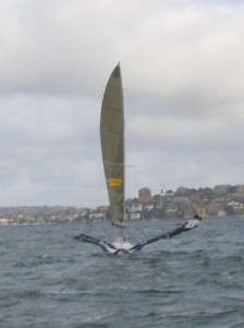 Pegasus Racing, Shark Kahn, Cameron MacDonald, and Geoff Moore sailing an 18 Foot Skiff during the World Championships in Sydney Australia 2005.